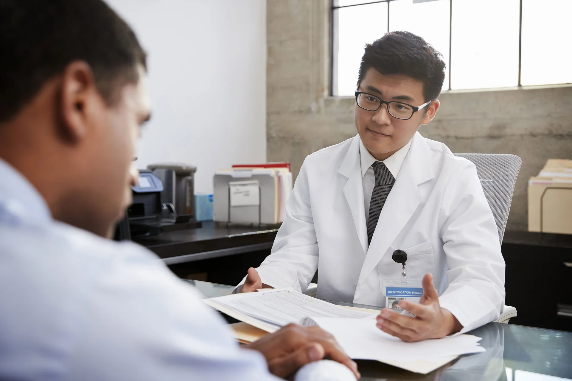 Doctor consulting patient